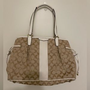 Tan and white Coach bag
